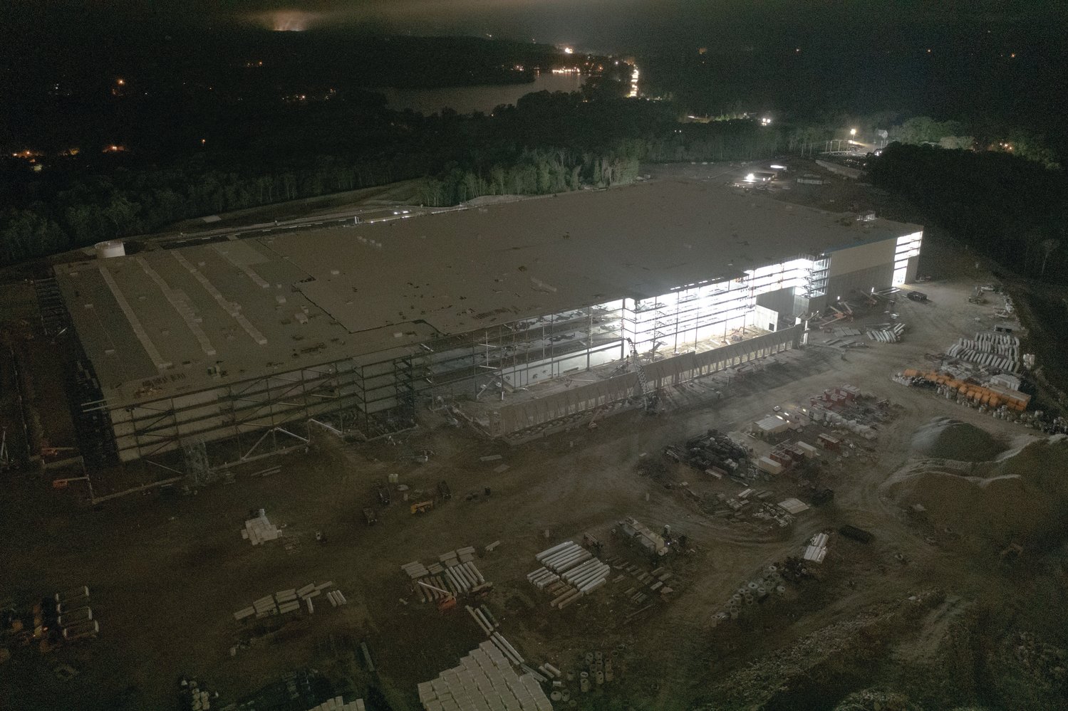 BLUE AND WHITE: These images of the Amazon construction site in Johnston, at and following sunset, were captured by drones piloted by Trevor Bryan, an FAA Licensed and insured drone pilot, the owner and operator of New England Aerial Services, on Sept. 21. For more information on the Warwick-based company, visit their Facebook page at www.facebook.com/newenglandaerialservices. 